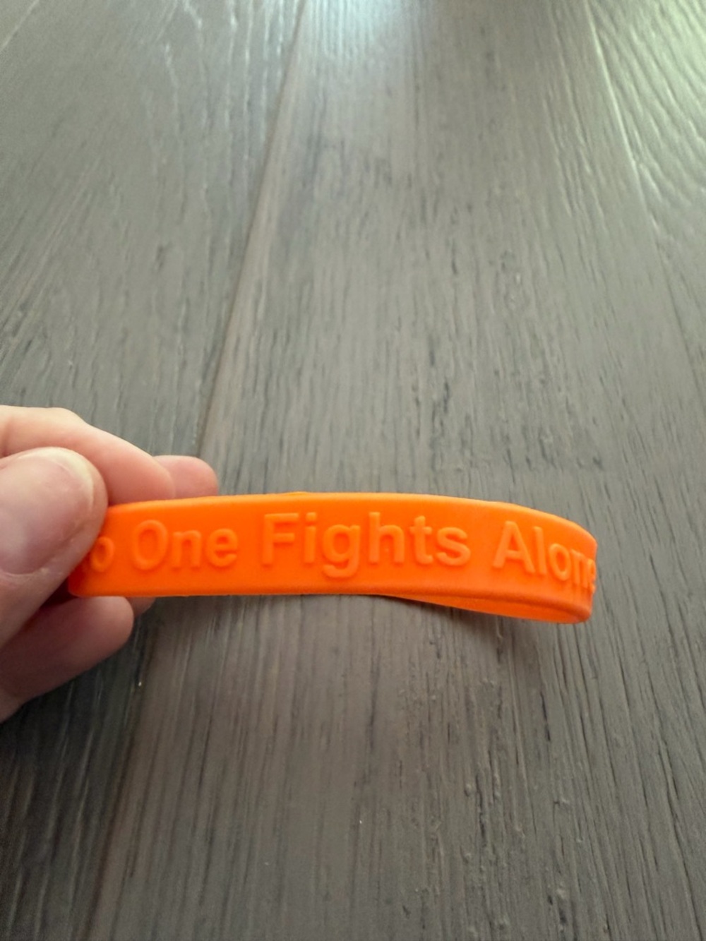 Orange Silicone Wristband "No One Fights Alone"